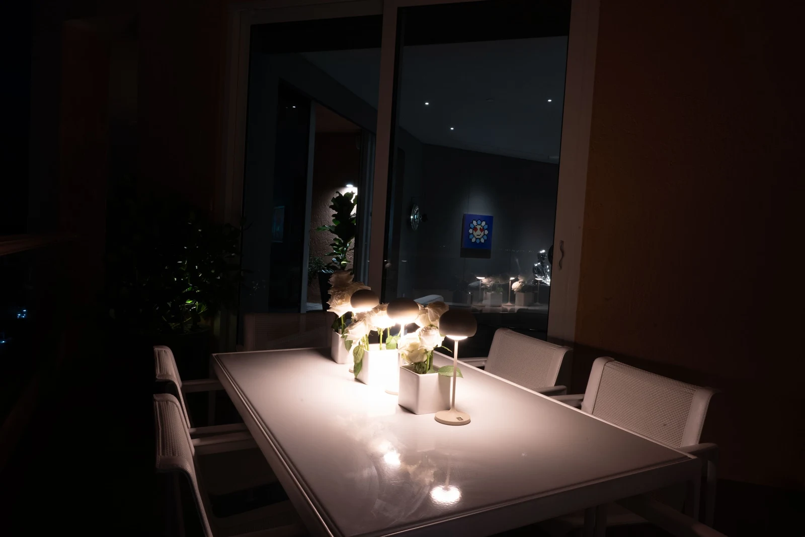 Apartment dining area illuminated at night