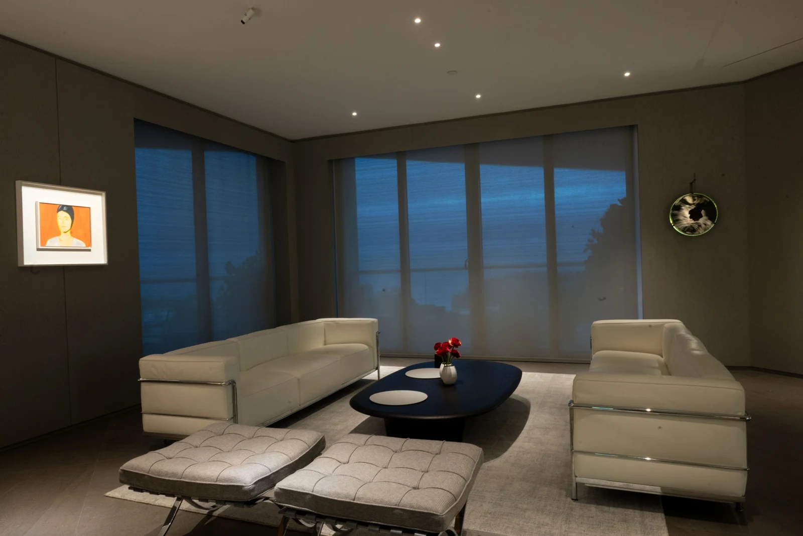 Apartment living room with recessed lighting and illuminated artwork